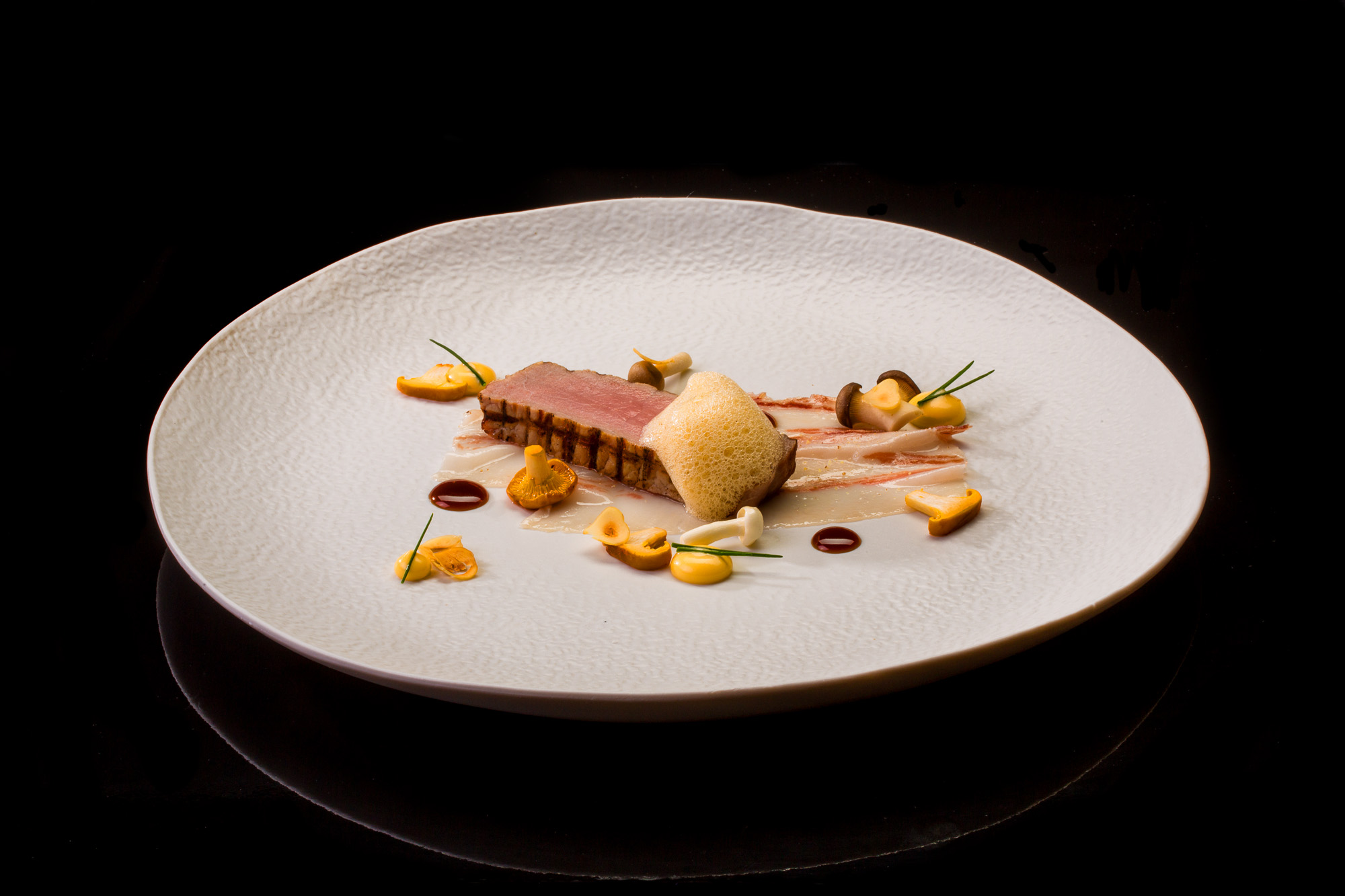 Escalope Joselito y panceta con setas de calabaza